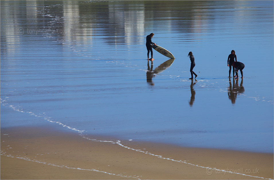 Surfers on Polzeath Beach