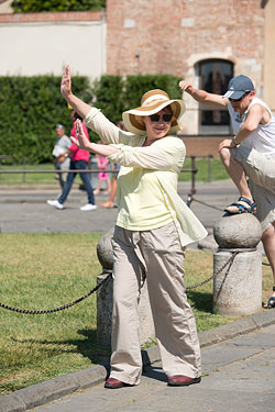 People Posing by The Leaning Tower of Pisa