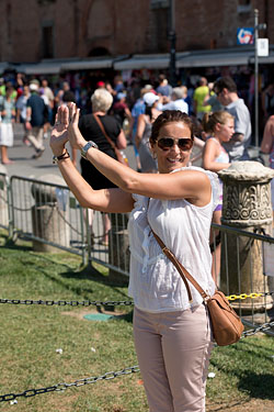 People Posing by The Leaning Tower of Pisa