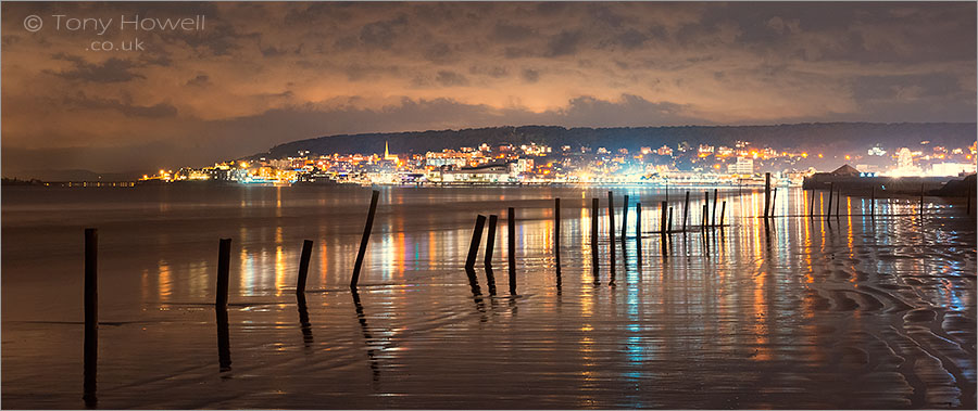 Beach and town at night